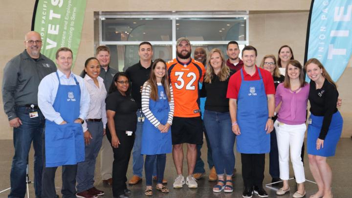 Members of the UPVETS and UP Ties leadership teams with Andy Janovich and OMT Catherine Antonio, third from left, a former Marine who spoke at the event.