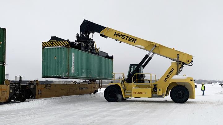Customers’ containers are loaded for departure from Iowa’s new intermodal terminal.
