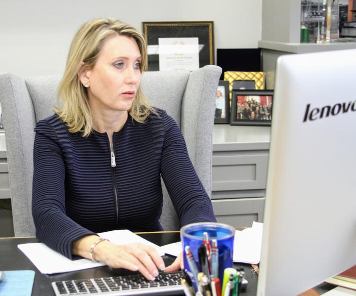 Kathy Lehne at work in her office, managing a fleet of more than 1,000 service trucks.