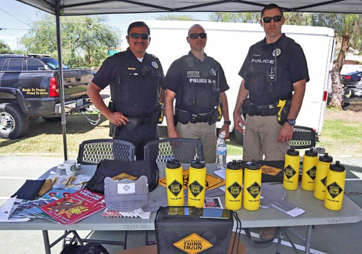 From left, special agents Daniel Guzman, Manuel Flores and Jeffrey Castillo host a safety fair in Tucson, Arizona.