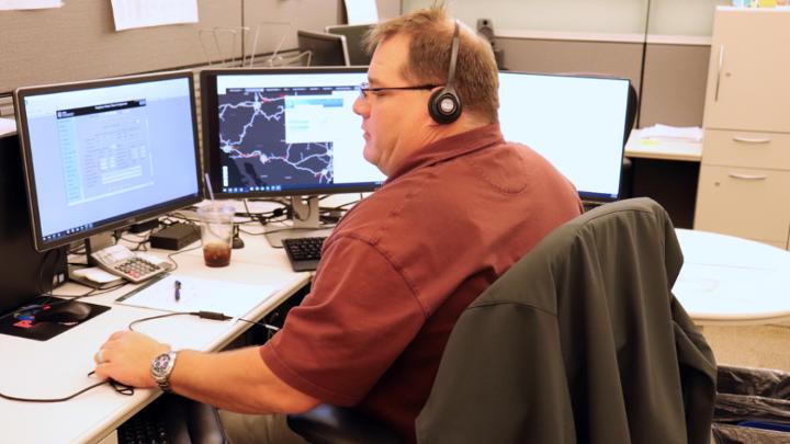 Sam Thomason, senior manager-Systems Quality Assurance, Safety, takes an OPCC phone call.