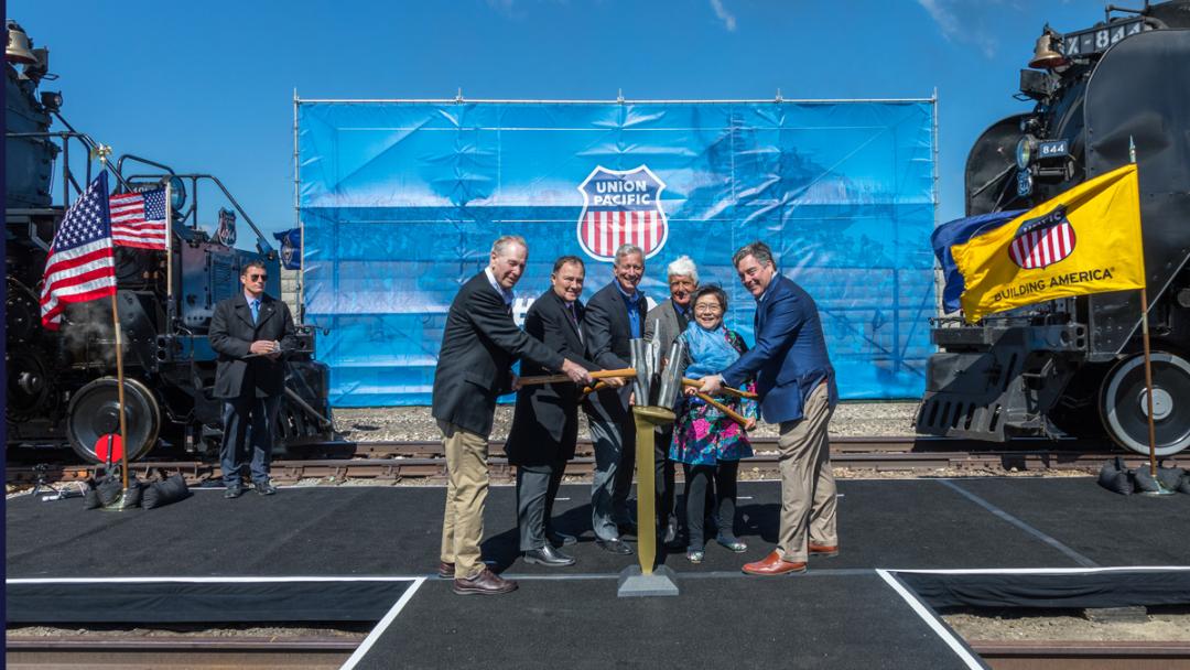 Recreating the tapping of the golden spike from left are Sandy Dodge, Utah Gov. Gary Herbert, Union Pacific Chairman Lance Fritz, Rep. Rob Bishop, Margaret Yee and Union Pacific Chief Administrative Officer Scott Moore.