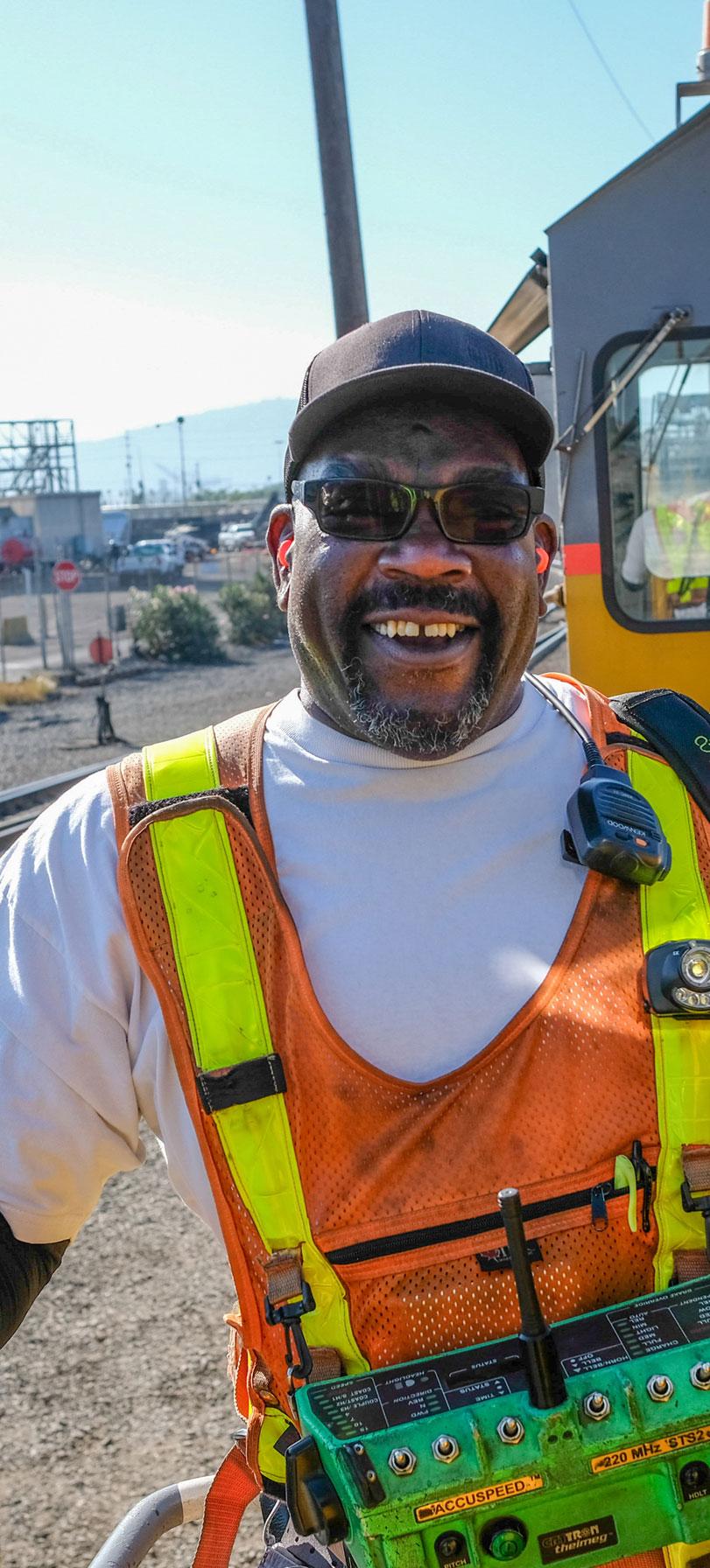 Brakeman Bobby Woods uses a remote control to move locomotives in Union Pacific's Long Beach, California, yard.