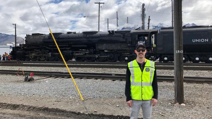 Jordan Shinn stands before Union Pacific’s Big Boy No. 4014 while implementing new best practices in Salt Lake City, Utah.