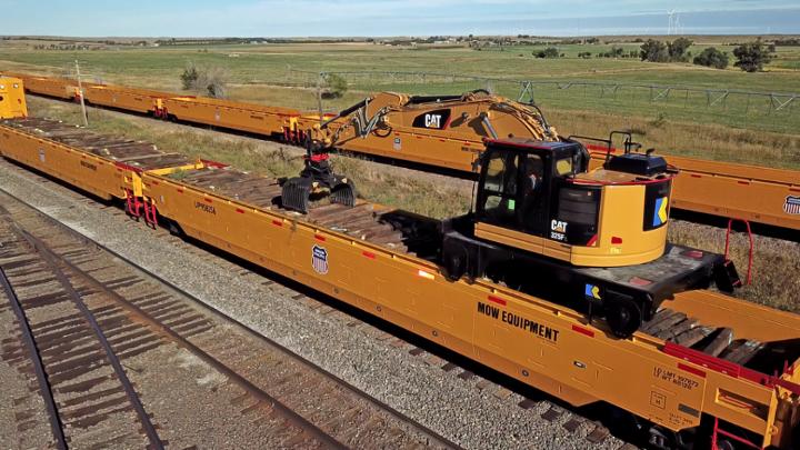 The new Maintenance of Way Tie Pickup work equipment follows a tie gang in Western Nebraska.