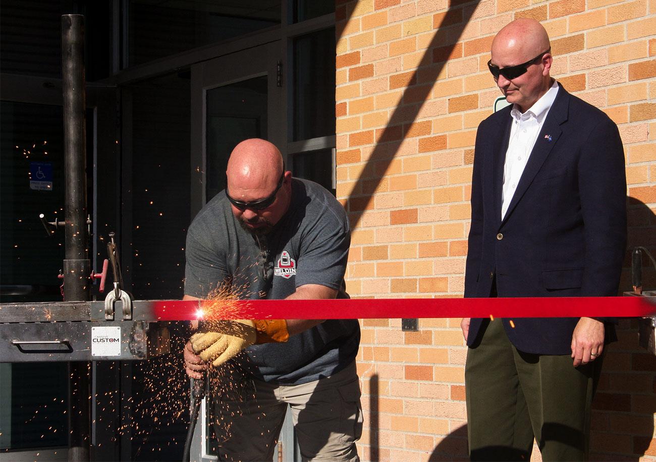 John Bombac joined Nebraska Governor and Westside Alum Pete Ricketts for the steel cutting ceremony at Omaha's Westside High School.