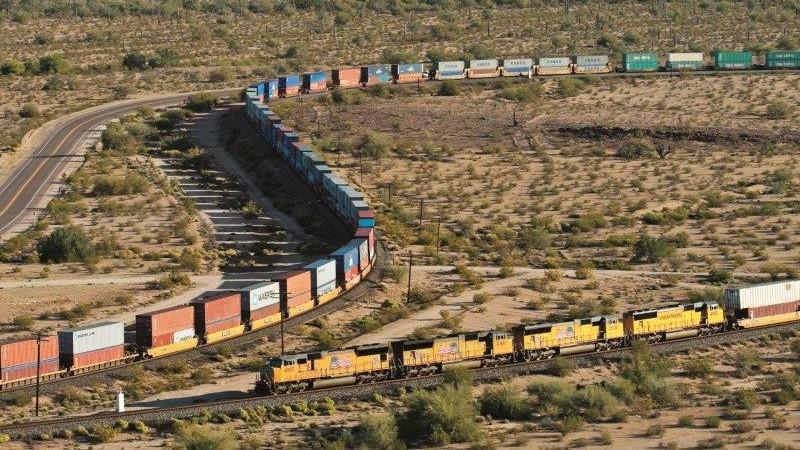 An intermodal train crossing the Arizona desert | O