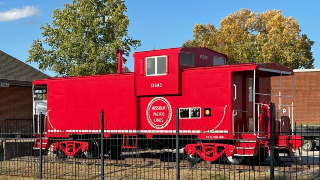 The restored Missouri Pacific caboose display in Pleasant Hill. | L