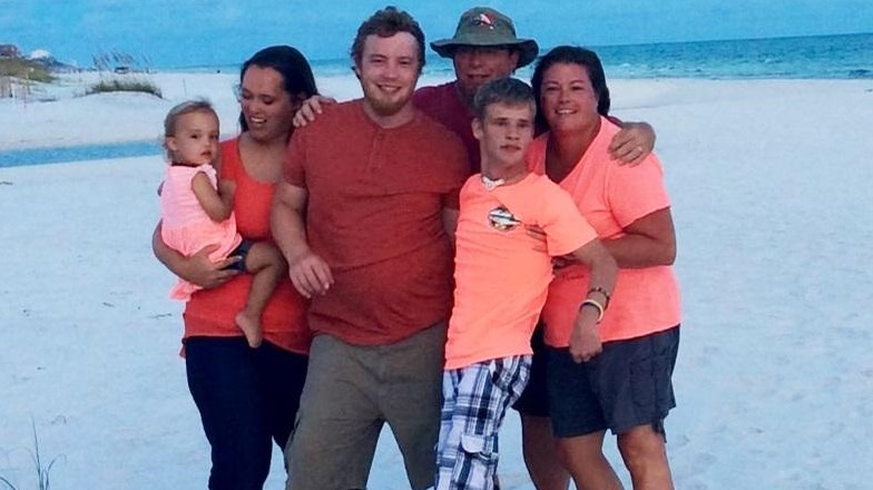 Zachary and Paul Smith with families on vacation.