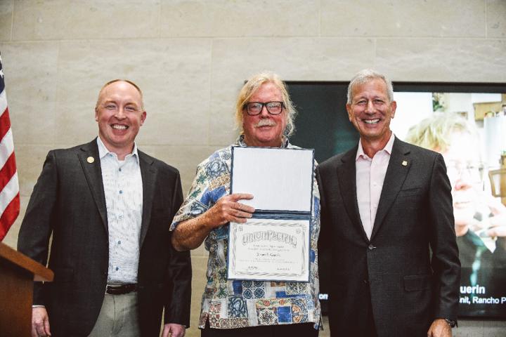 Eric Gehringer, Executive Vice President-Operations, and Lance Fritz, Chairman, President and CEO, congratulate James Guerin for 50 years of service to Union Pacific.
