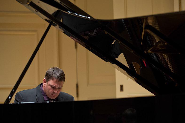 Attila Gibson playing the piano.