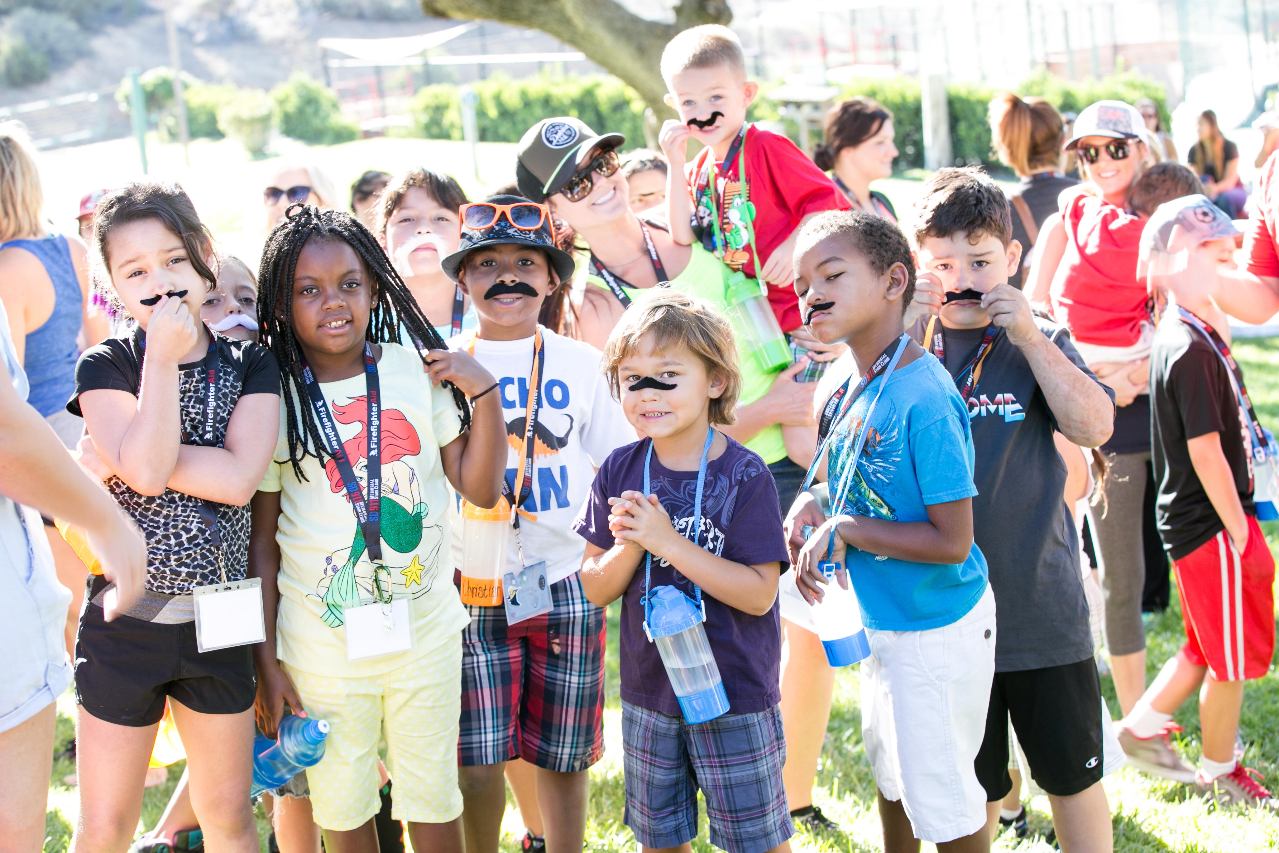 Camp Beyond the Scars campers gather for mustache mania.