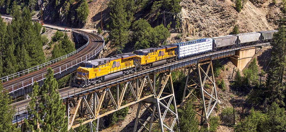 Building America Report 2016 - UP 7861 leads a manifest train across a bridge at Keddie, California.