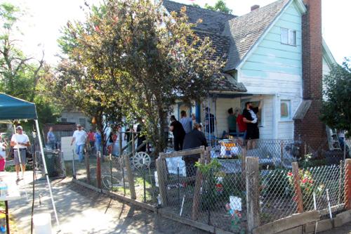 Volunteers painting the bullock home