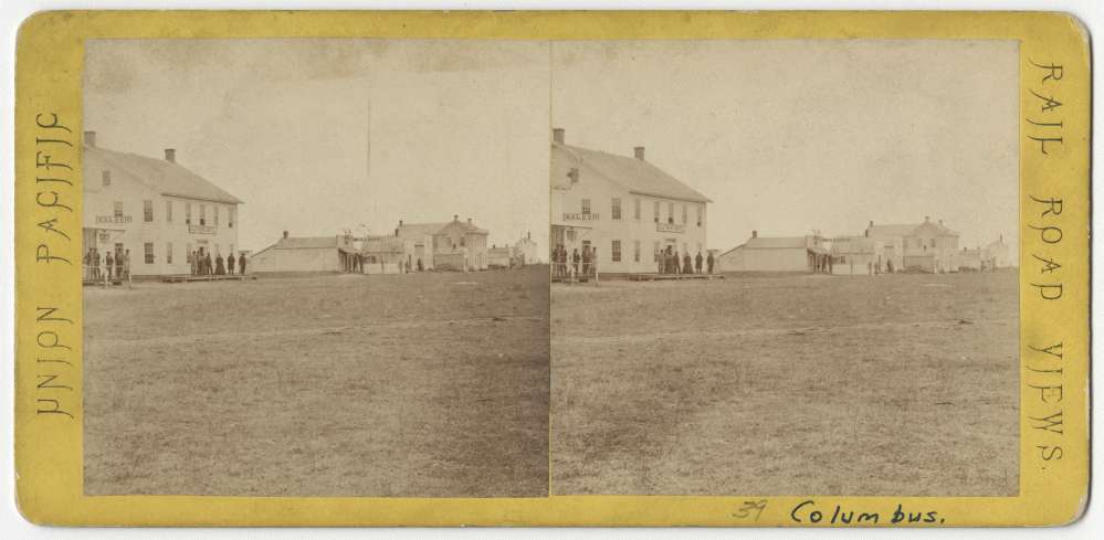 A stereo card howing Front Street in Columbus, Nebraska.