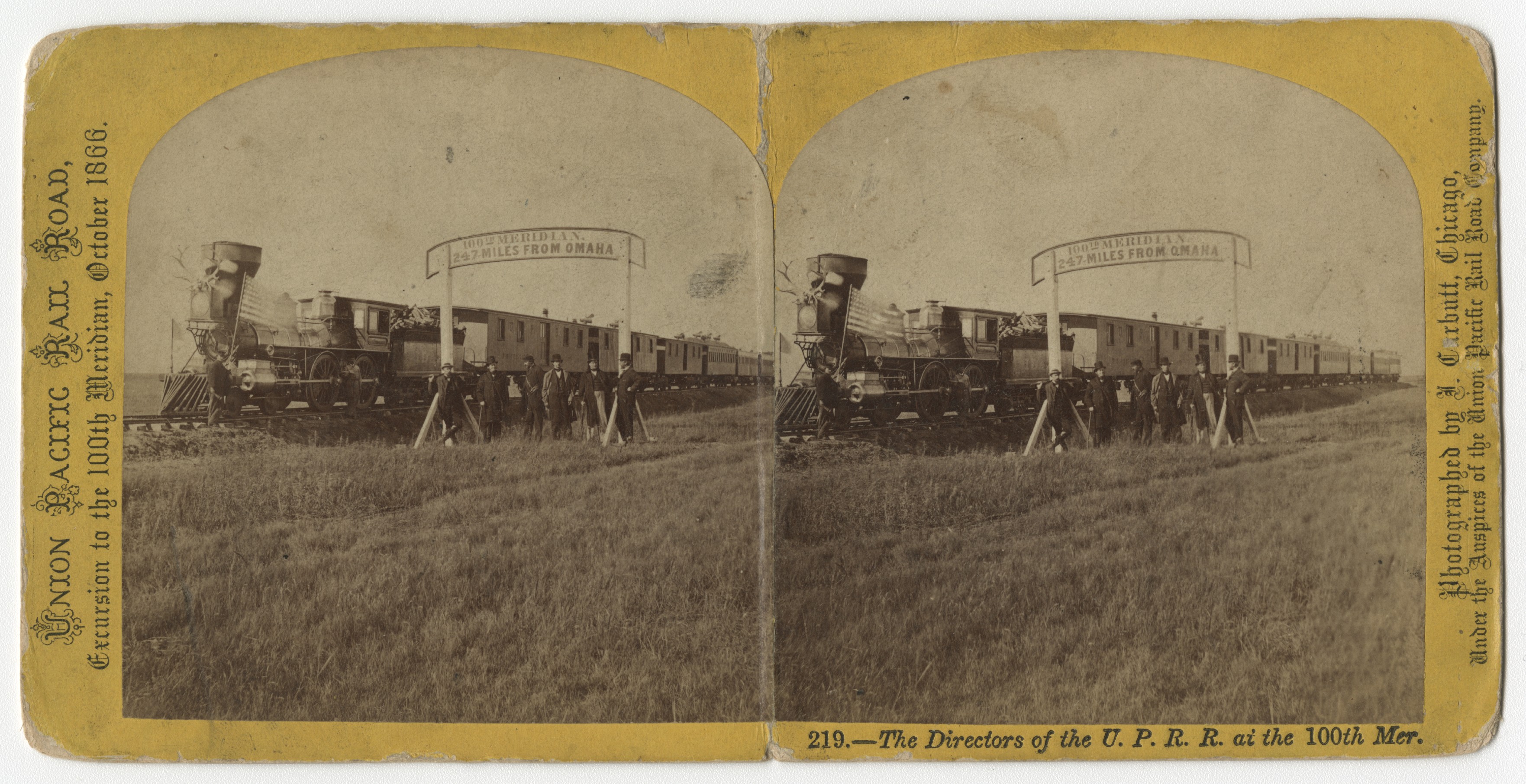A stereo card of Union Pacific directors gathering beside a steam locomotive