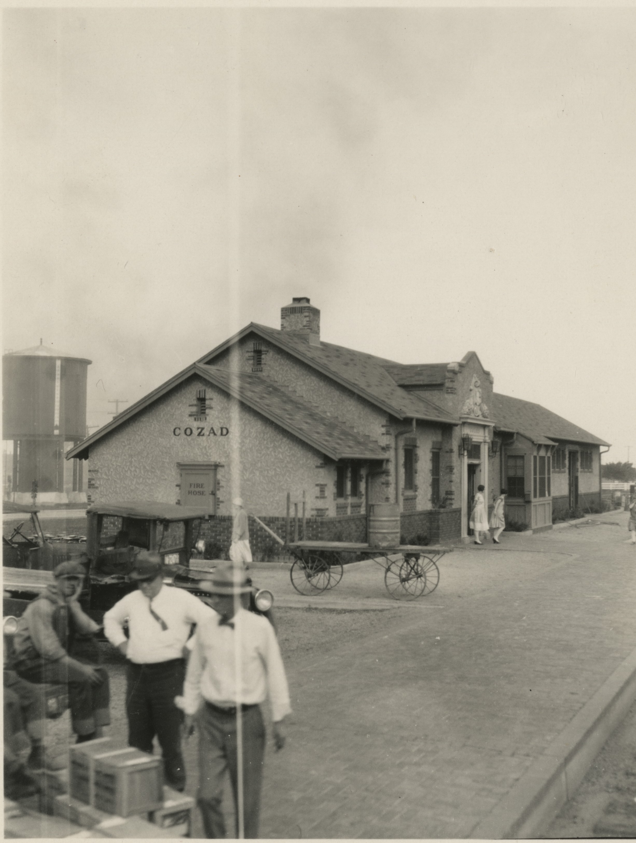 Busy train station in Cozad, Nebraska c 1910