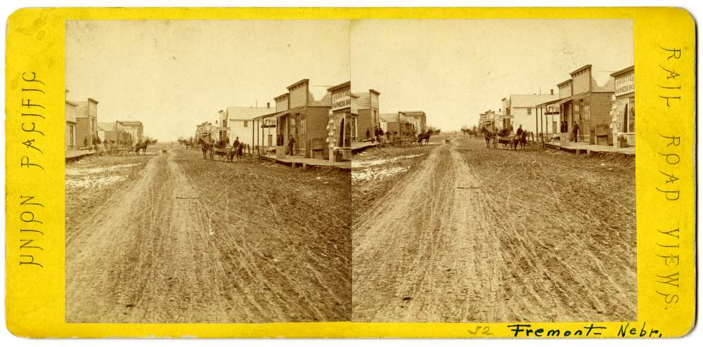 A stereo card showing a street in Fremont, Nebraska