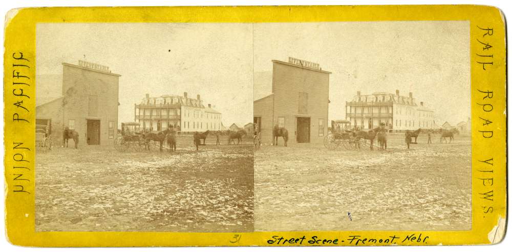 A stereo card showing a street scene in Fremont, Nebraska