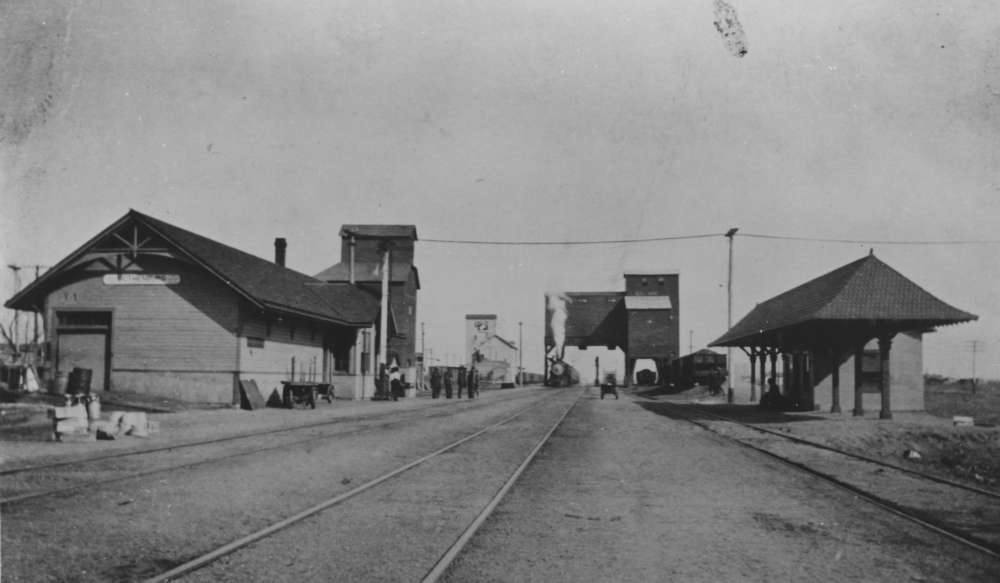 Photograph of a train depot, and coaling tower, in Gothenburg, Nebraska, c 1910