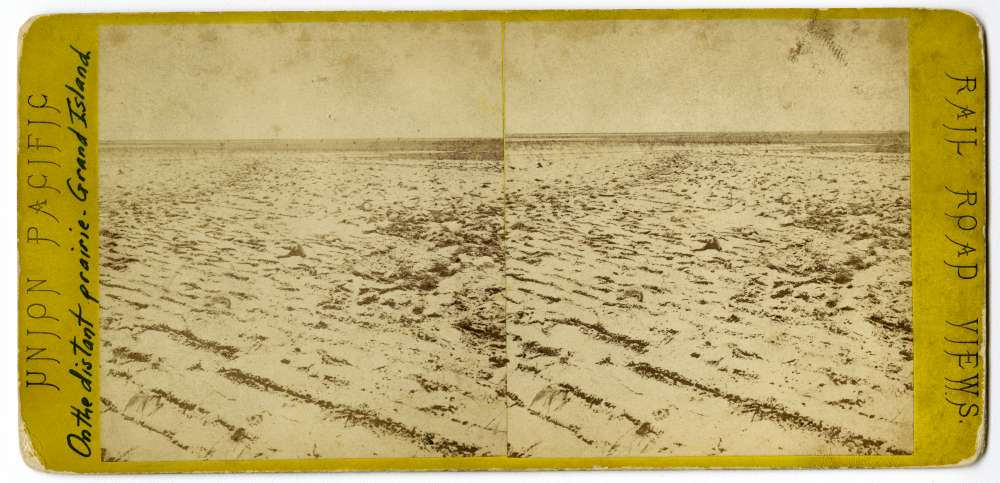 A stereo card showing a distant prairie in Grand Island, Nebraska