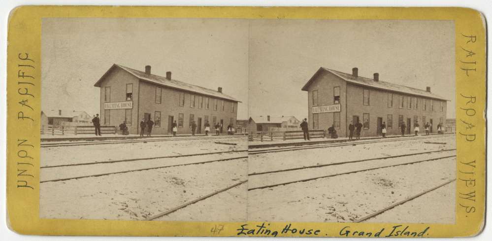 A stereo card showing an eating house in Grand Island, Nebraska