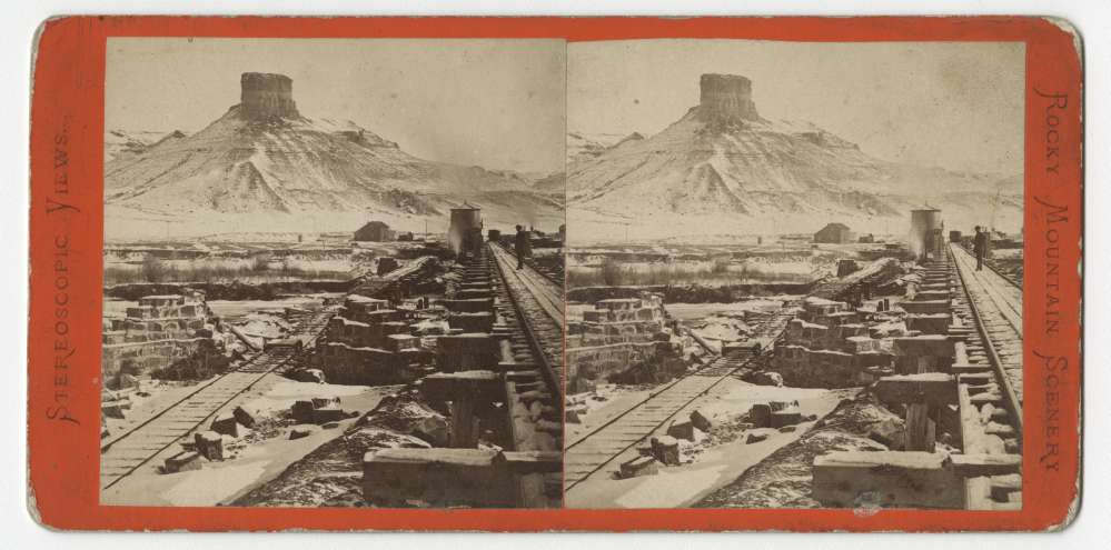 A stereo card showing a temporary bridge and Citadel Rock at Green River, Wyoming