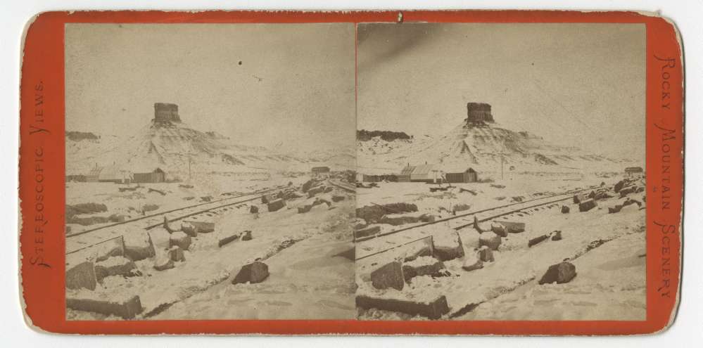 A stereo card showing Citadel Rock at Green River, Wyoming
