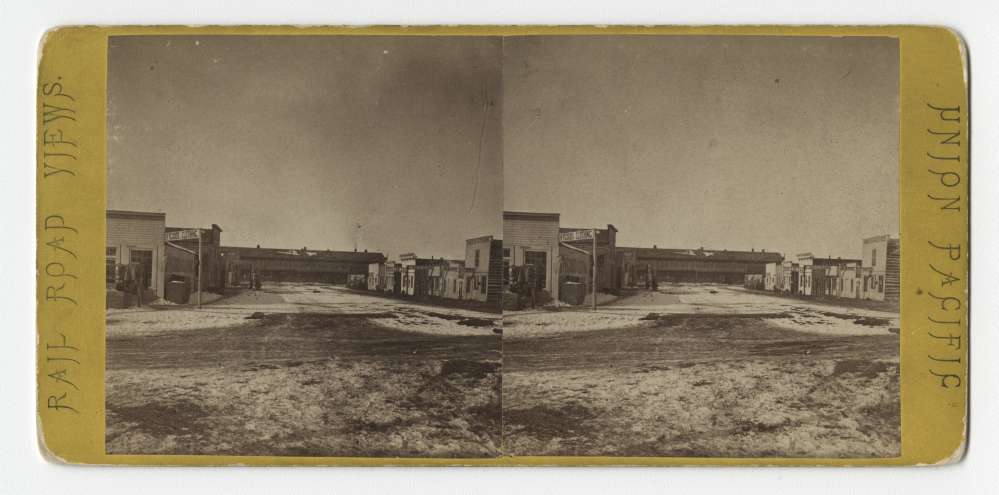 A stereo card showing B Street, looking East, in Laramie, Wyoming