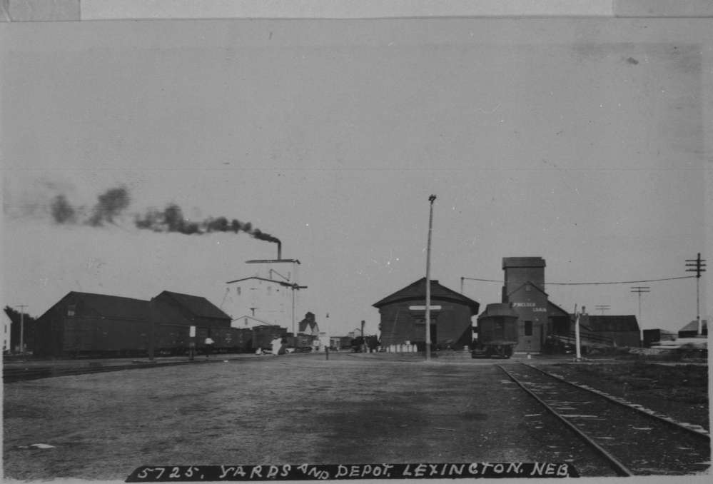 Photograph showing yards, buildings, and a depot in Lexington, Nebraska