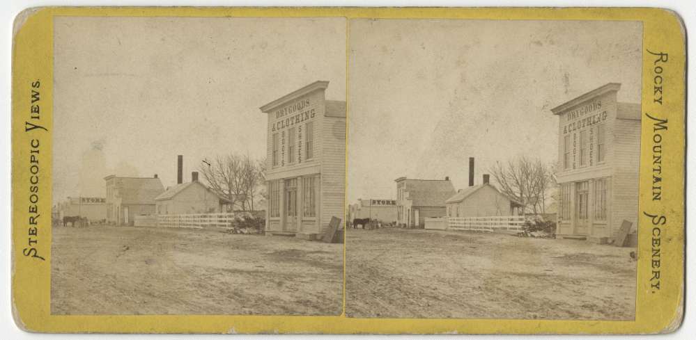 A stereo card showing Front Street and the North Platte Station, North Platte, Nebraska