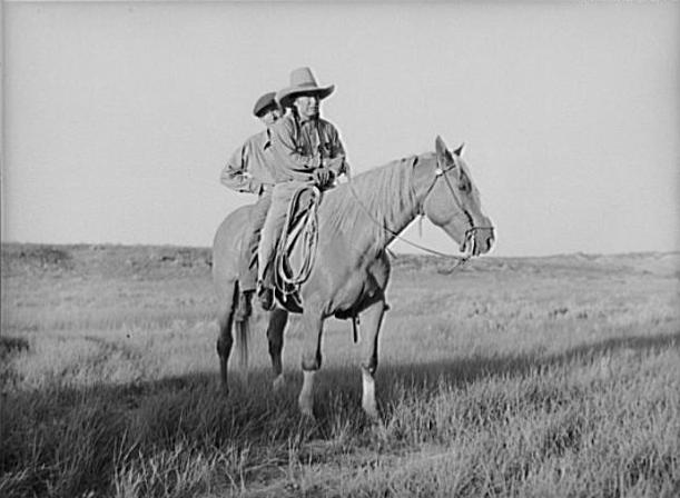 Cheyenne Indian and son on a horse