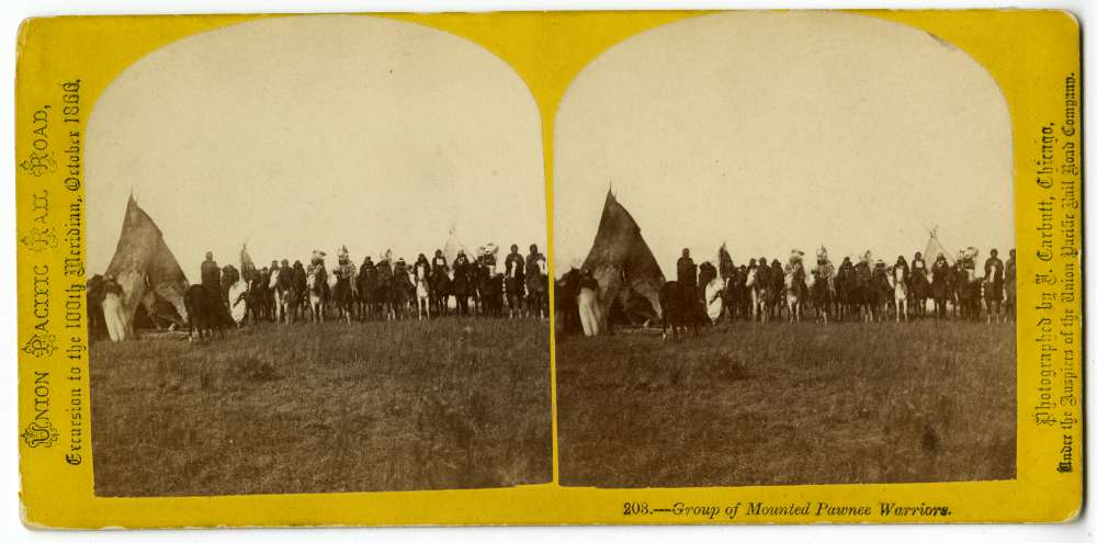 A stereocard showing a group of mounted Pawnee warriors