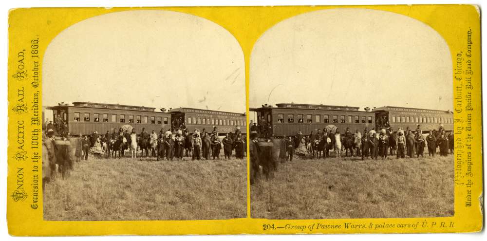 A company of Pawnee Scouts and Union Pacific excursionists arranged in front of the excursion train