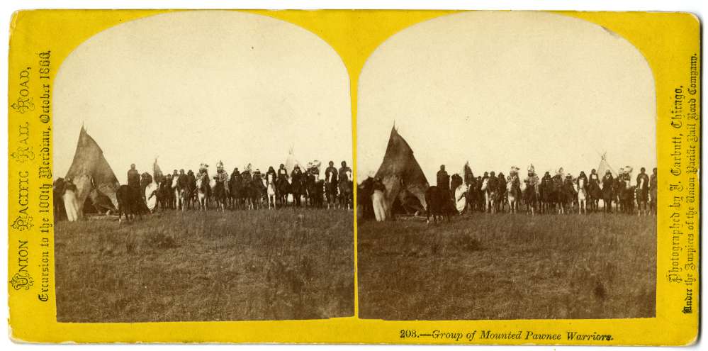 A stereocard showing a group of mounted Pawnee warriors