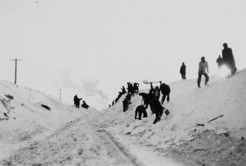 Union Pacific employees remove snow from track after famous 1949 blizzard