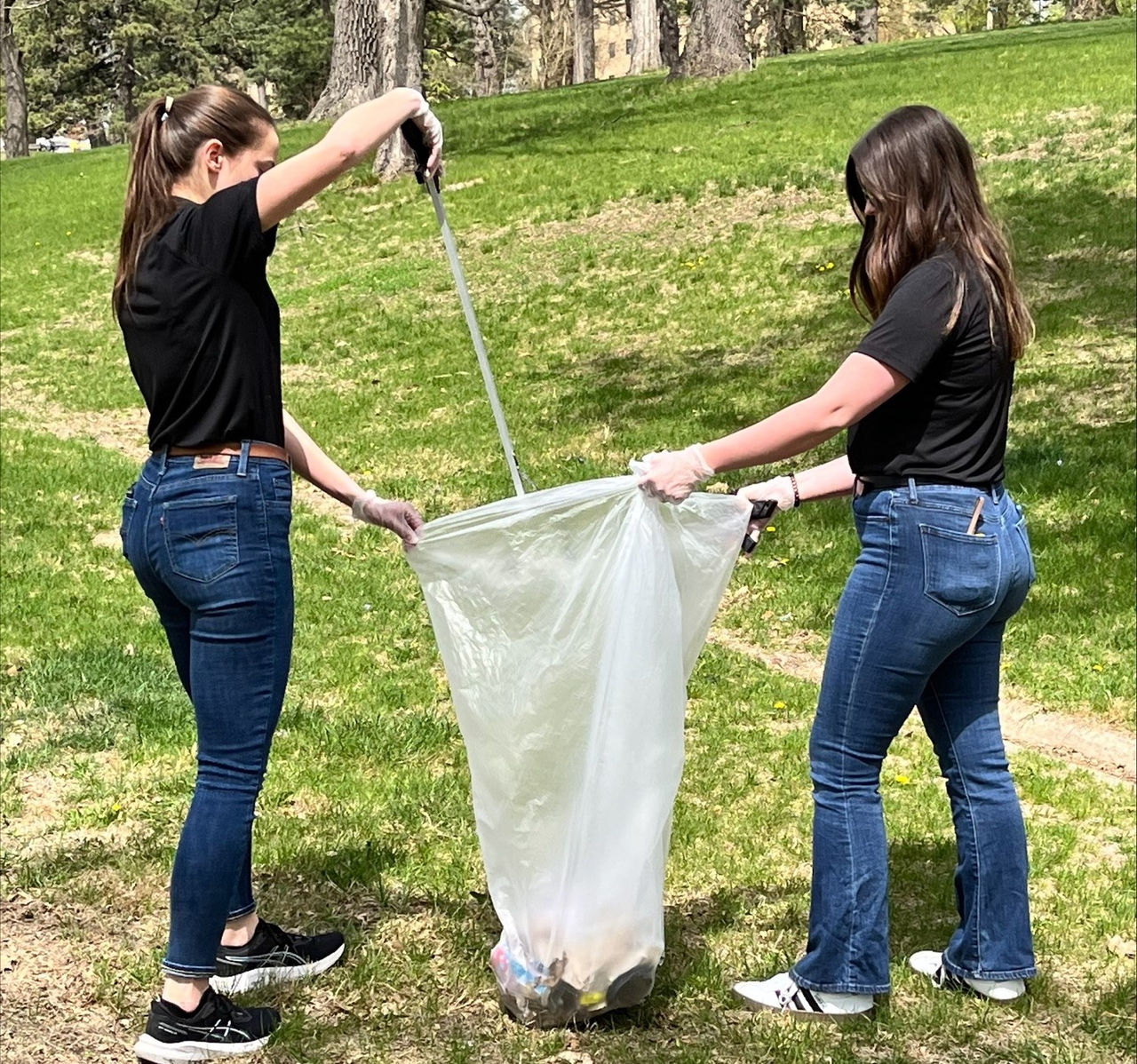 Two Union Pacific employees pick up trash
